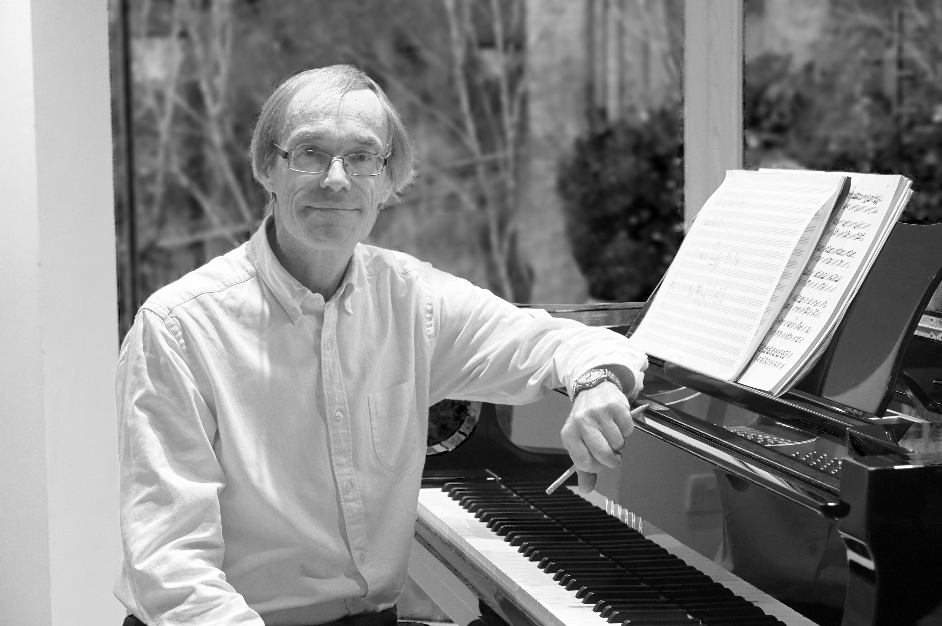 Peter Hugh White, composing at the piano